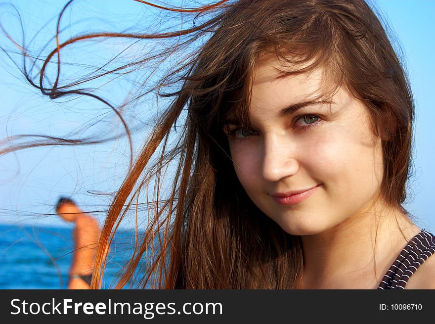 Women's portrait on sea background