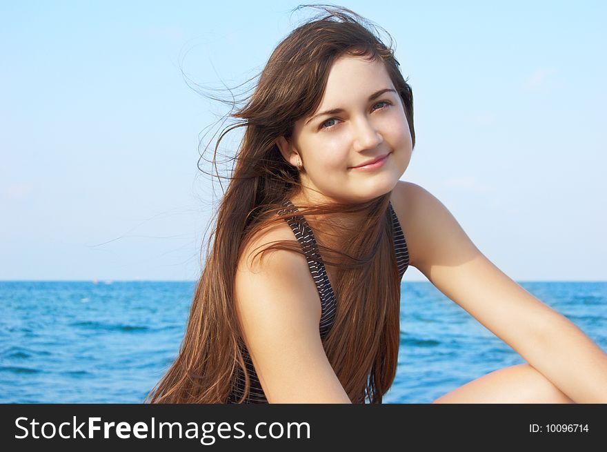 Women's portrait on sea background