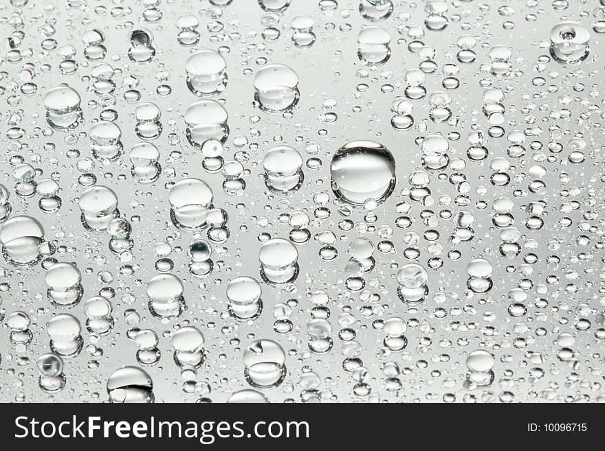 Water drops over a mirror