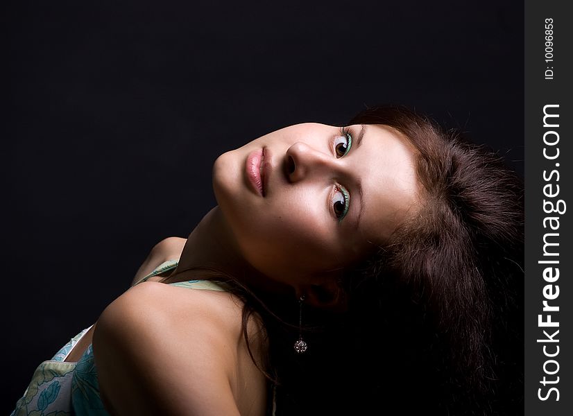 Cute teenager. Isolated on a  black background
