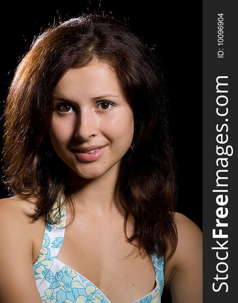 Cute teenager girl. Isolated on a  black background