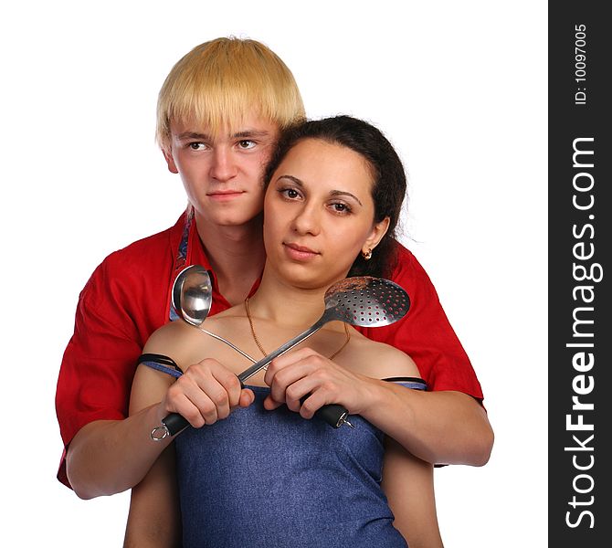 Young man and woman embraces with utensil. Isolated.