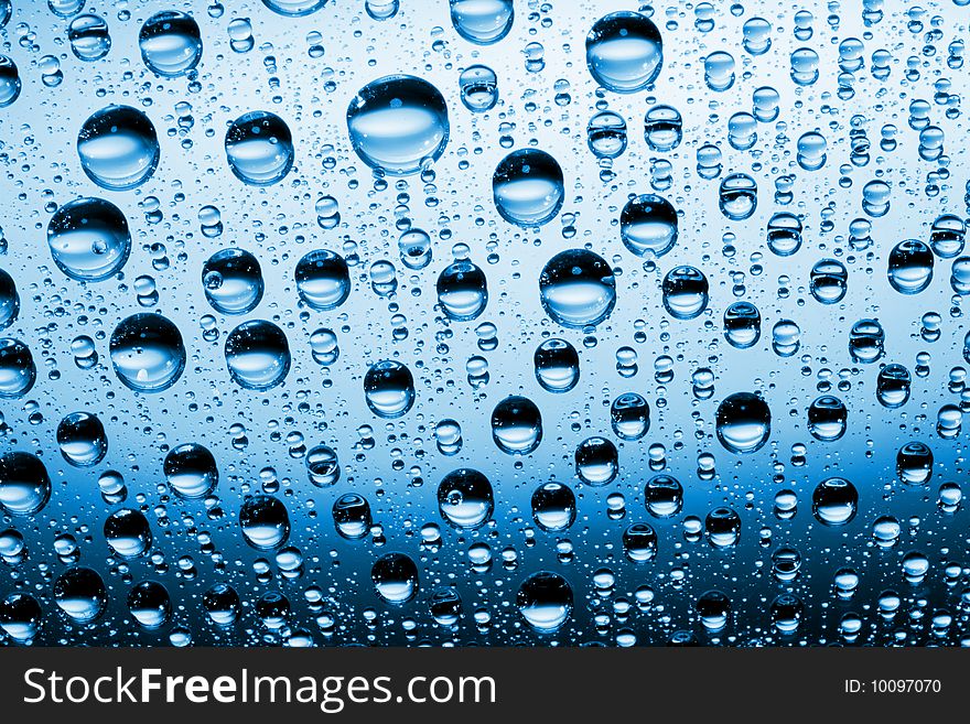 Water drops against blue background. Water drops against blue background