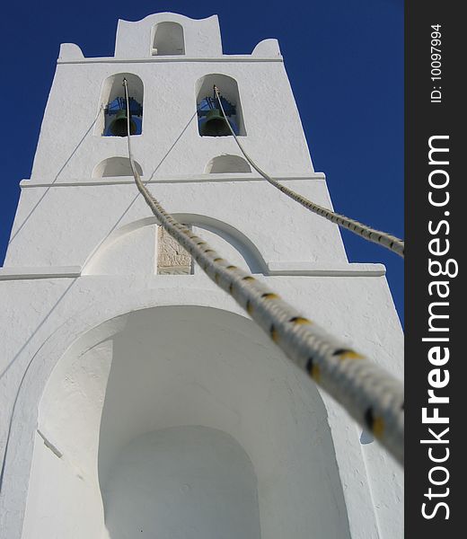 A greek church in front of blue skies. A greek church in front of blue skies