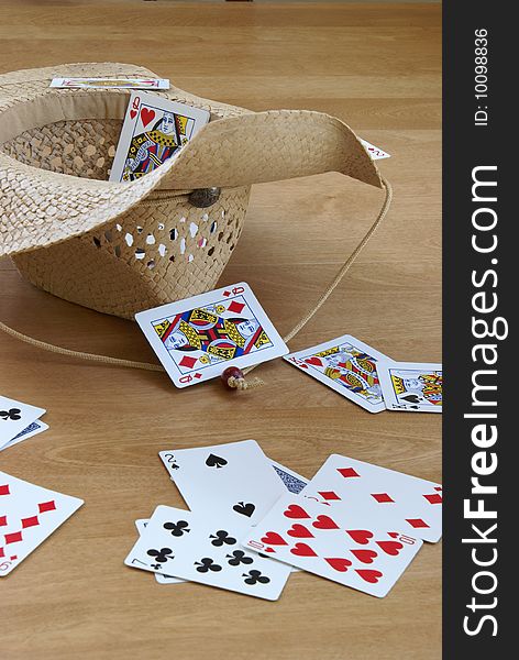 A game of tossing cards into a hat.
