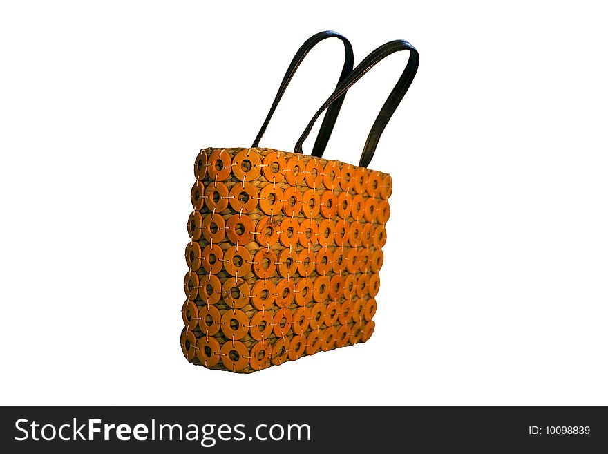 A womans bag made out of wood and straw together with some orange textile- isolted on white. A womans bag made out of wood and straw together with some orange textile- isolted on white