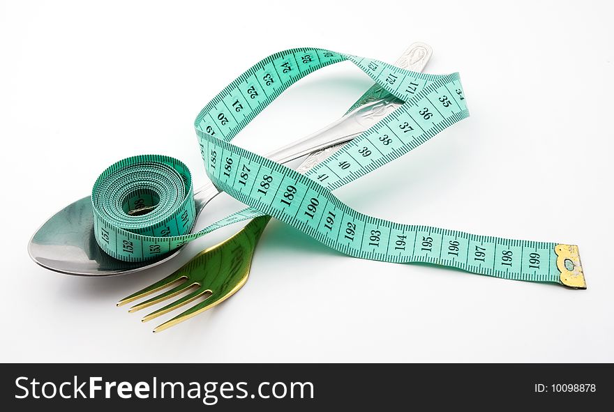 Cutlery with a measuring tape, diet, moderate eating. Cutlery with a measuring tape, diet, moderate eating