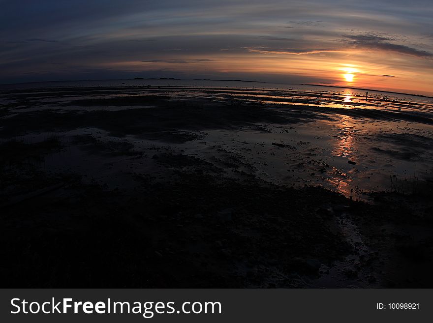 Sunset on the sea shore, fisheye distortion
