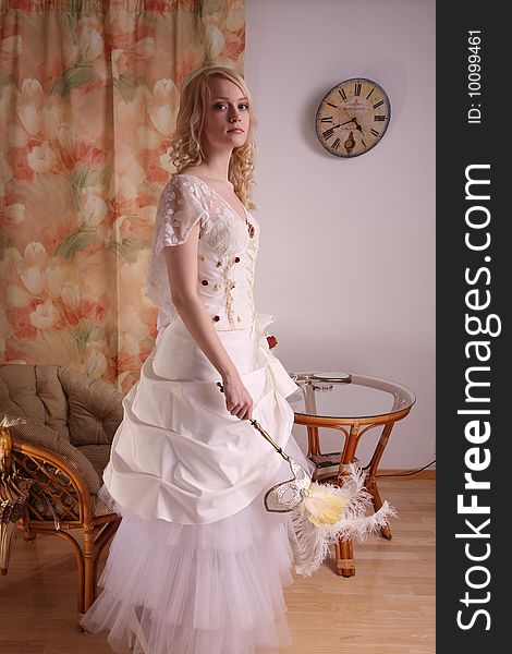 Beautiful model wearing a wedding dress, studio. Beautiful model wearing a wedding dress, studio