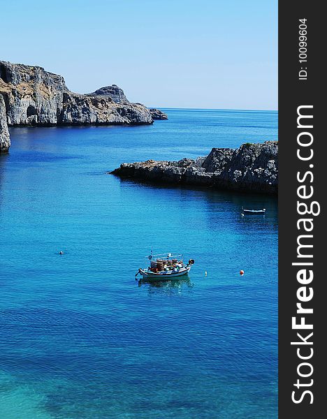 Boat on waters of St. Paul Bay on Rhodes, Greece. Boat on waters of St. Paul Bay on Rhodes, Greece