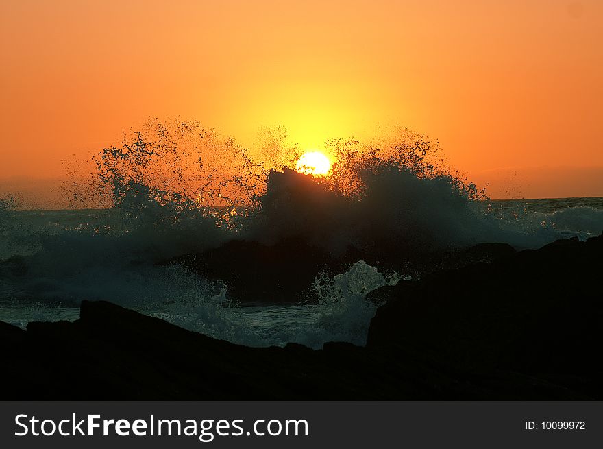 Beatiful sunset with great fantastic waves in Portugal, Algarve