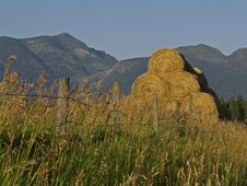 Stacked Hay And Mountains Stock Photo Stacked Hay And Mountains Stock Photo