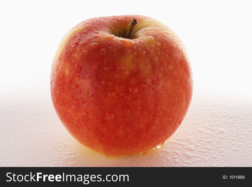 Fresh red apple against a white background