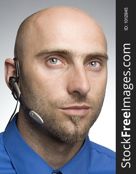 Handsome businessman with phoneheadset. Handsome businessman with phoneheadset
