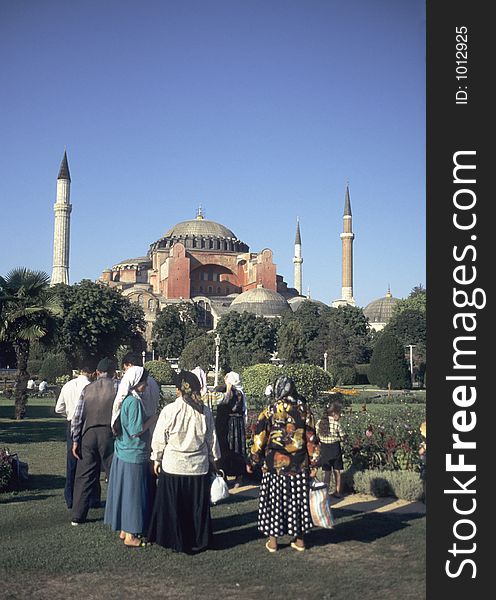 Turkish tourists in the gardens of hagia sophia in istanbul. Turkish tourists in the gardens of hagia sophia in istanbul
