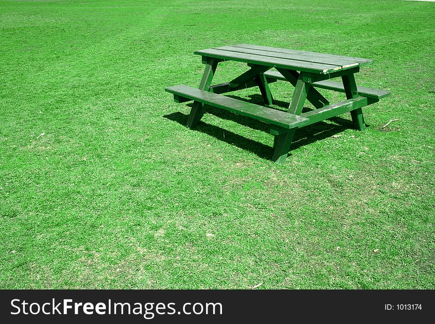 Park bench in a field