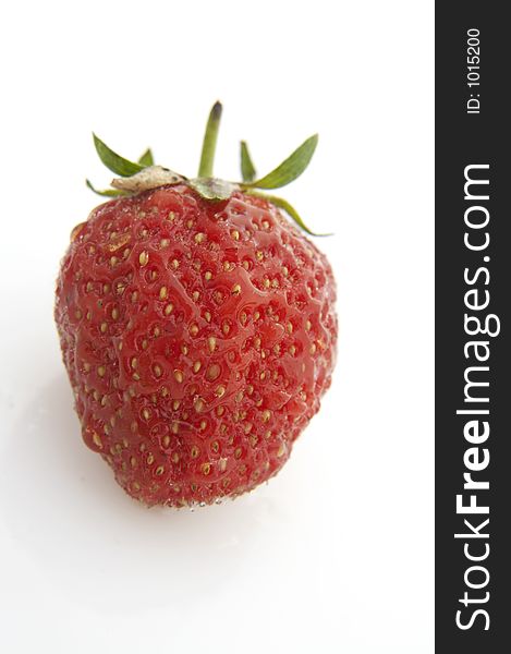 Wet strawberry on white background