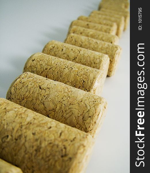 Collection of corks rolled in a line