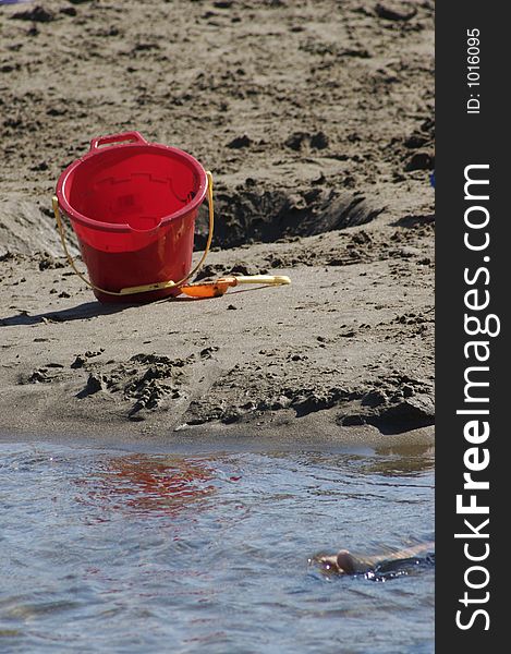 Pail and shovel by the water