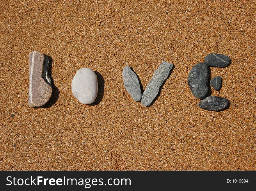 The word love on the beach