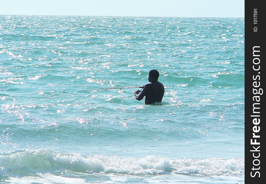 Passing through sunday afternoon fishing in the sea. Passing through sunday afternoon fishing in the sea