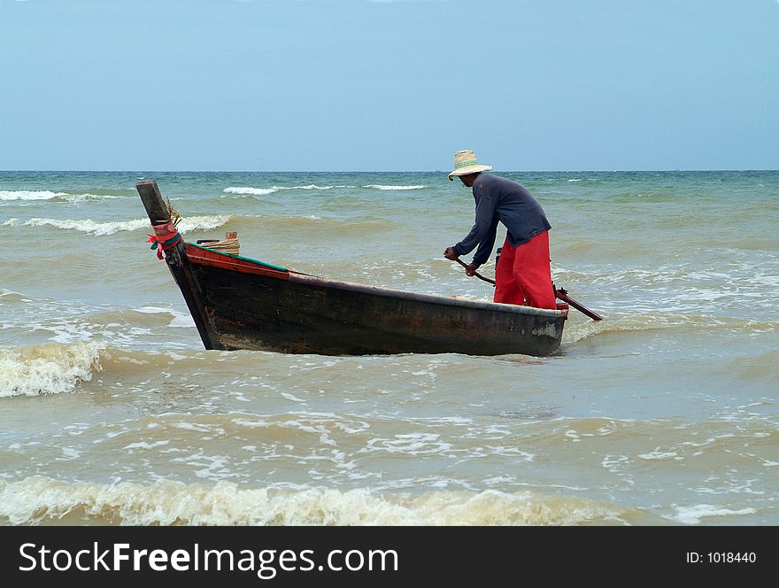 Boat approaching the coast under windy conditions in Chonburi province, Thailand. Boat approaching the coast under windy conditions in Chonburi province, Thailand