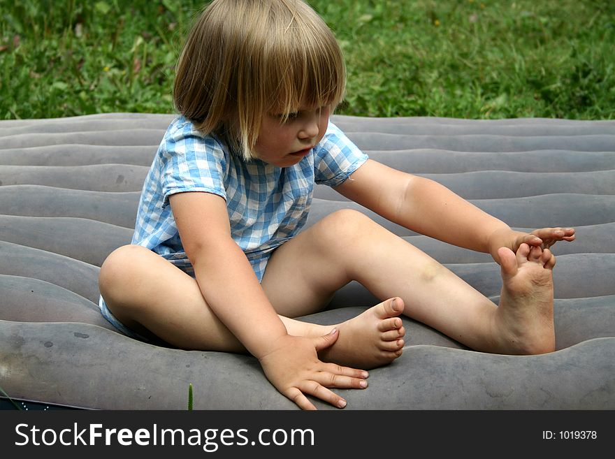 A girl on a inflatable mattress. A girl on a inflatable mattress