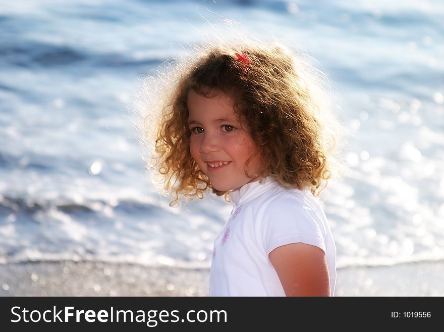 Little girl's expression: happiness at the seaside. Little girl's expression: happiness at the seaside