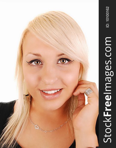 Portrait of a very beautiful blond woman in a black dress, holding her
left hand on the ear and smiling in the camera. For white background. Portrait of a very beautiful blond woman in a black dress, holding her
left hand on the ear and smiling in the camera. For white background.