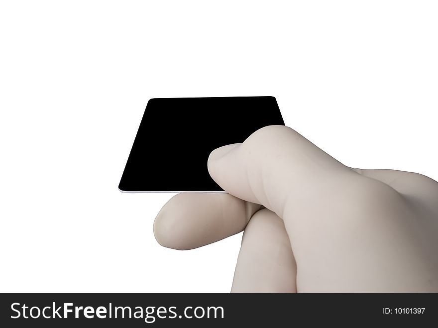 Hand in latex medical glove holding a credit card isolated over white background.