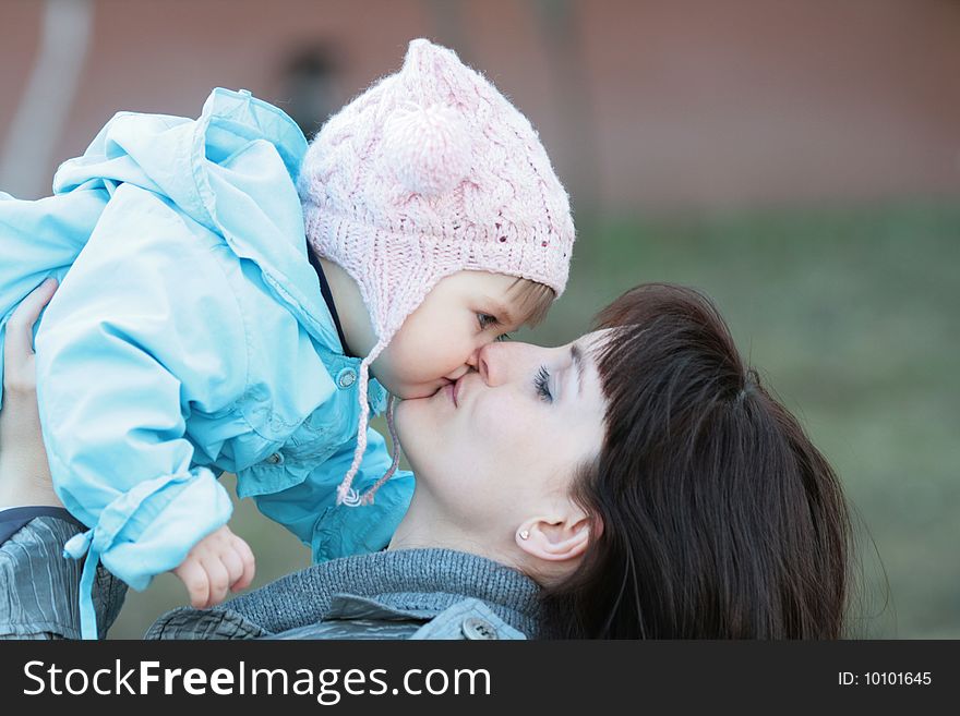 Kiss of mum with a daughter