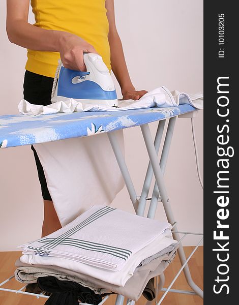 Woman Ironing At Home