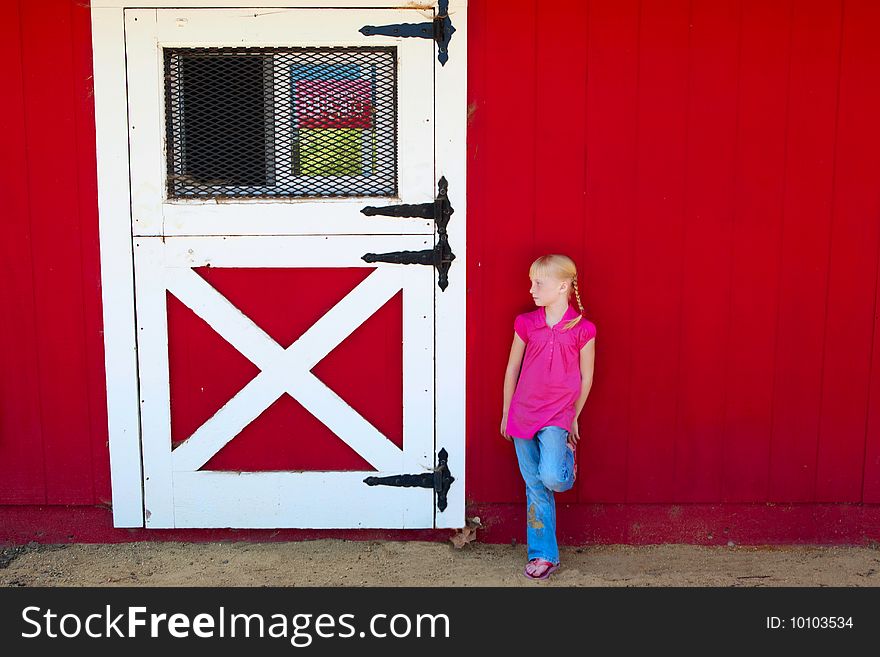 Girl in front of the Barn