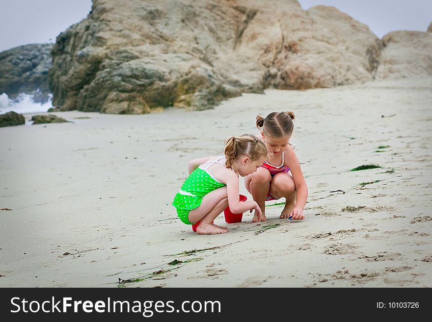 Girls playing in the sand