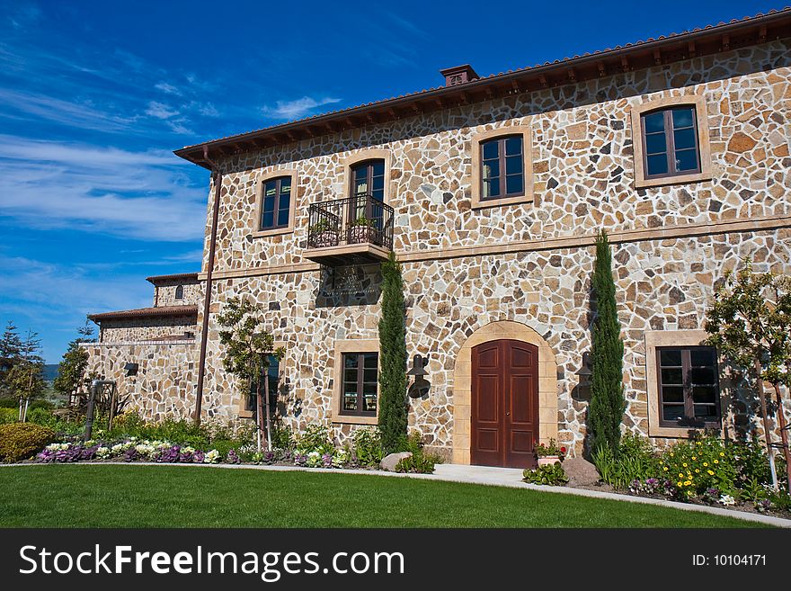 Impressive Napa Valley winery under blue skies, California.