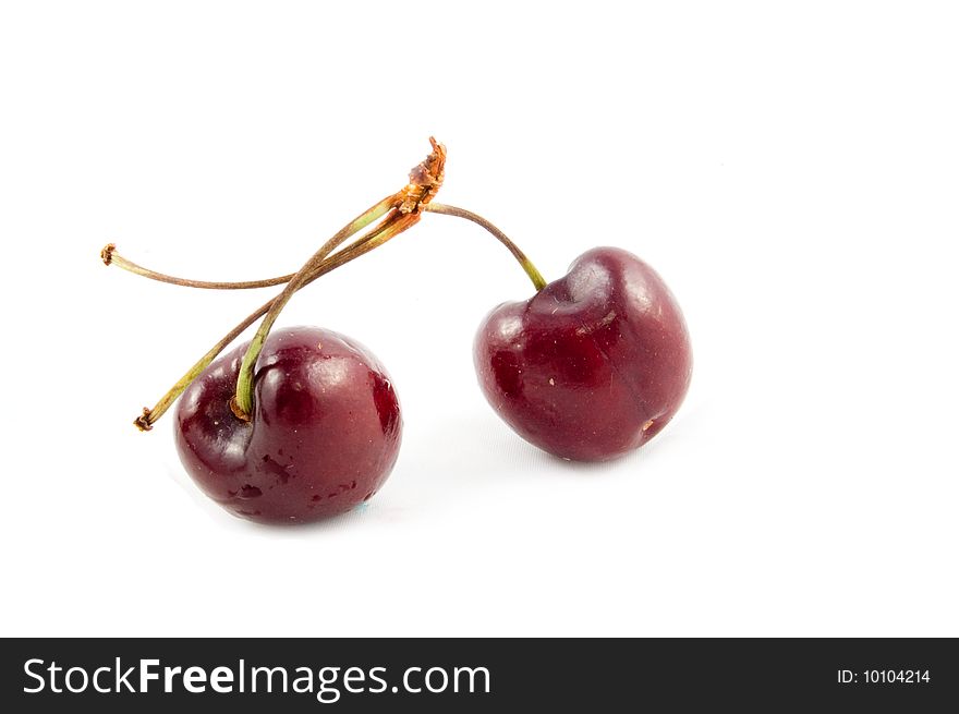 Two Cherries Against White Background