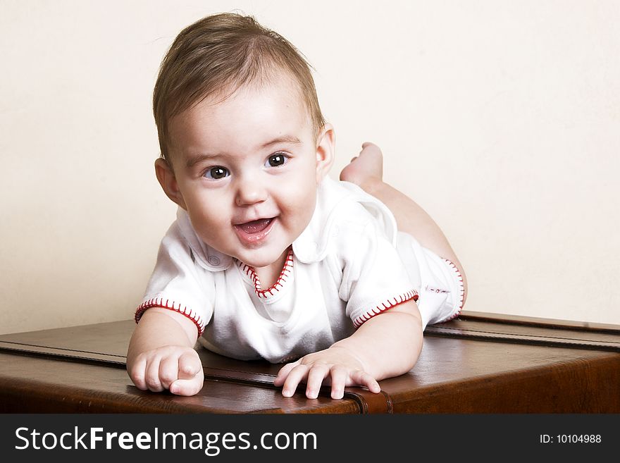 Beautiful brunette baby girl with cute facial expressions