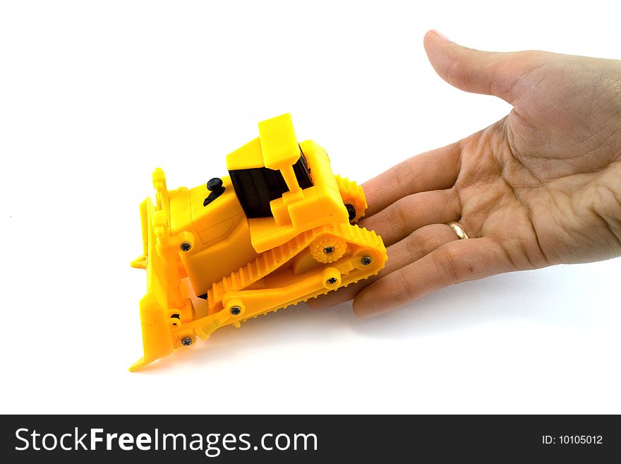 Hand and tractor on white background