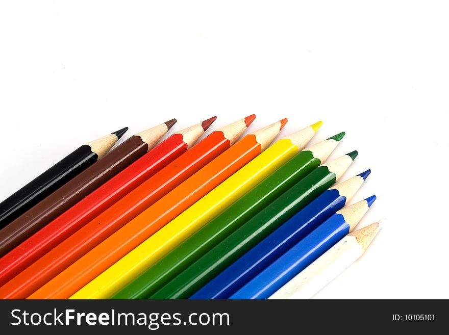 Varicoloured pencils on white background