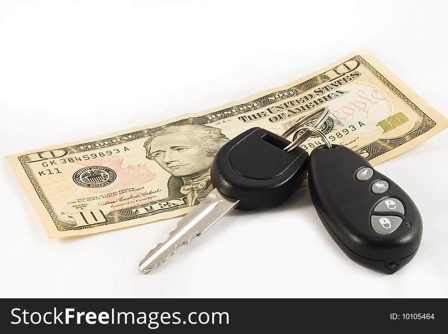 Car key with remote control and a ten US dollar bill. Car key with remote control and a ten US dollar bill