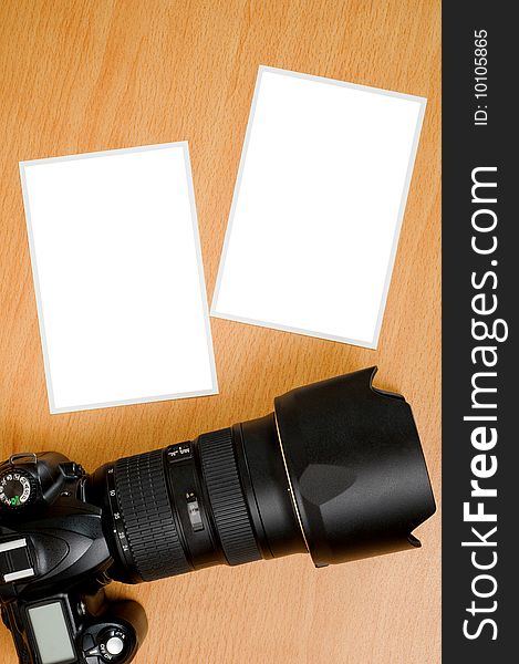 SLR camera and blank photo prints
