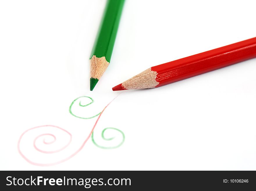 Red and green pencil isolated on white background