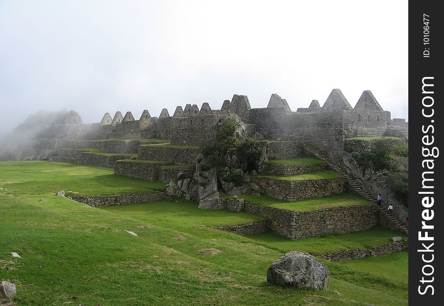 Machu Picchu huts under the fog, Andes, Perù, South America