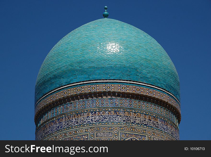 Architectural details of Kalyan Mosque dome with blue sky background, Buchara silk road, Uzbekistan. Architectural details of Kalyan Mosque dome with blue sky background, Buchara silk road, Uzbekistan.