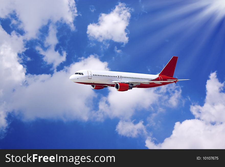 Airplane in air on blue sky