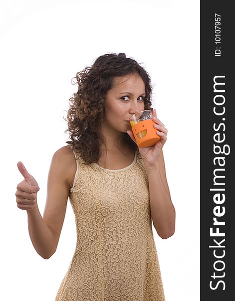 Smiling young healthy woman holding the orange in her hand. Woman is drinking orange juice. Isolated over white background. Girl showing thumbs up on. Happiness woman shows OK. Smiling young healthy woman holding the orange in her hand. Woman is drinking orange juice. Isolated over white background. Girl showing thumbs up on. Happiness woman shows OK.