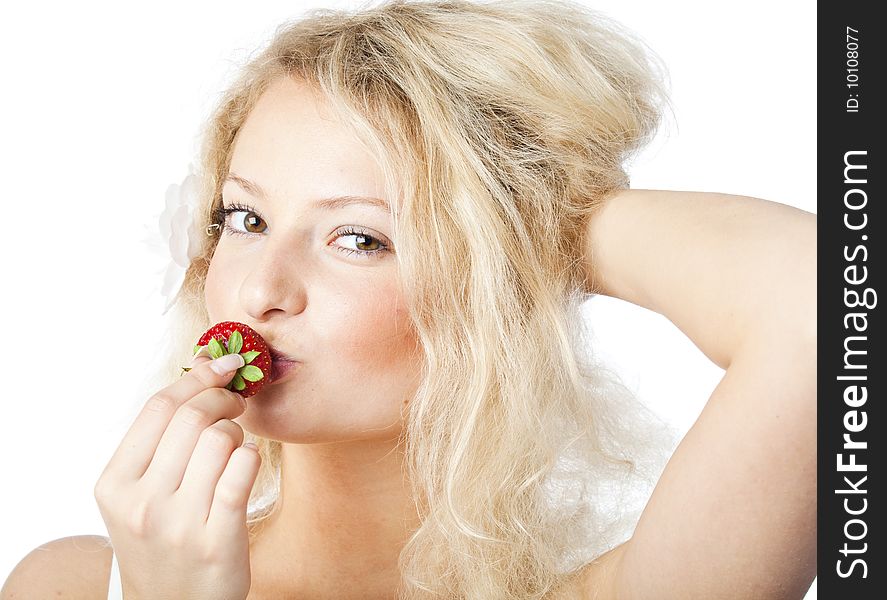 Young Woman In White Dress Eating Strawberries