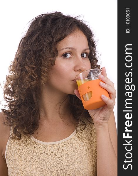 Beautiful young girl with orange. Pretty Woman and Fruit Diet Series. Smiling young healthy woman holding the orange in her hand. Woman is drinking orange juice. Isolated over white background. Beautiful young girl with orange. Pretty Woman and Fruit Diet Series. Smiling young healthy woman holding the orange in her hand. Woman is drinking orange juice. Isolated over white background.