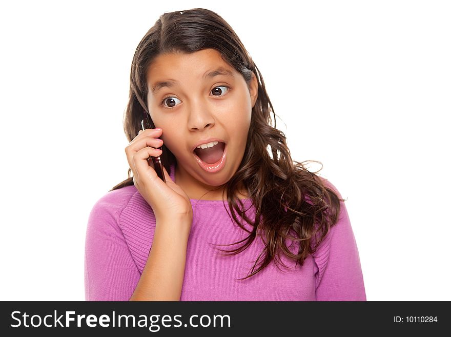 Shocked Pretty Hispanic Girl On Cell Phone Isolated on a White Background.