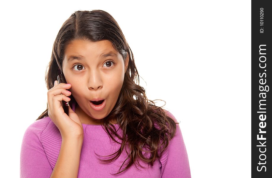 Shocked Pretty Hispanic Girl On Cell Phone Isolated on a White Background.